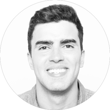 Gabe De Almeida smiling in a denim shirt